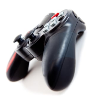 Black video game controller - isolated over a white background